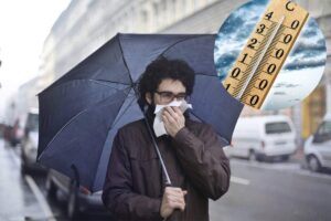 persona sotto la pioggia, temperature basse